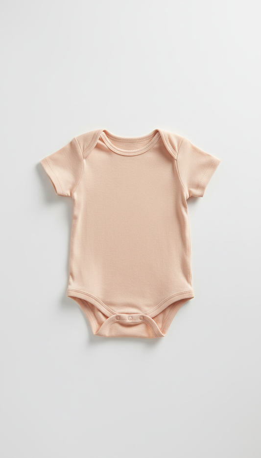 Cotton short-sleeve onesie in petal peach
